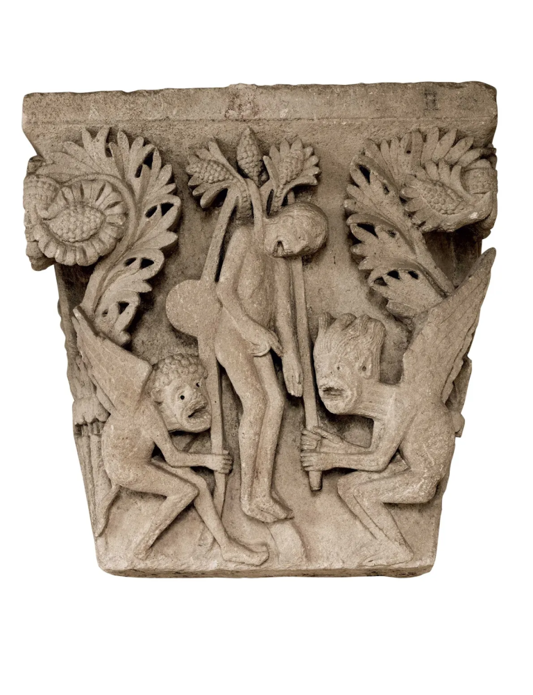 A a contorted Judas being hanged by demons at the Autun Cathedral, France
