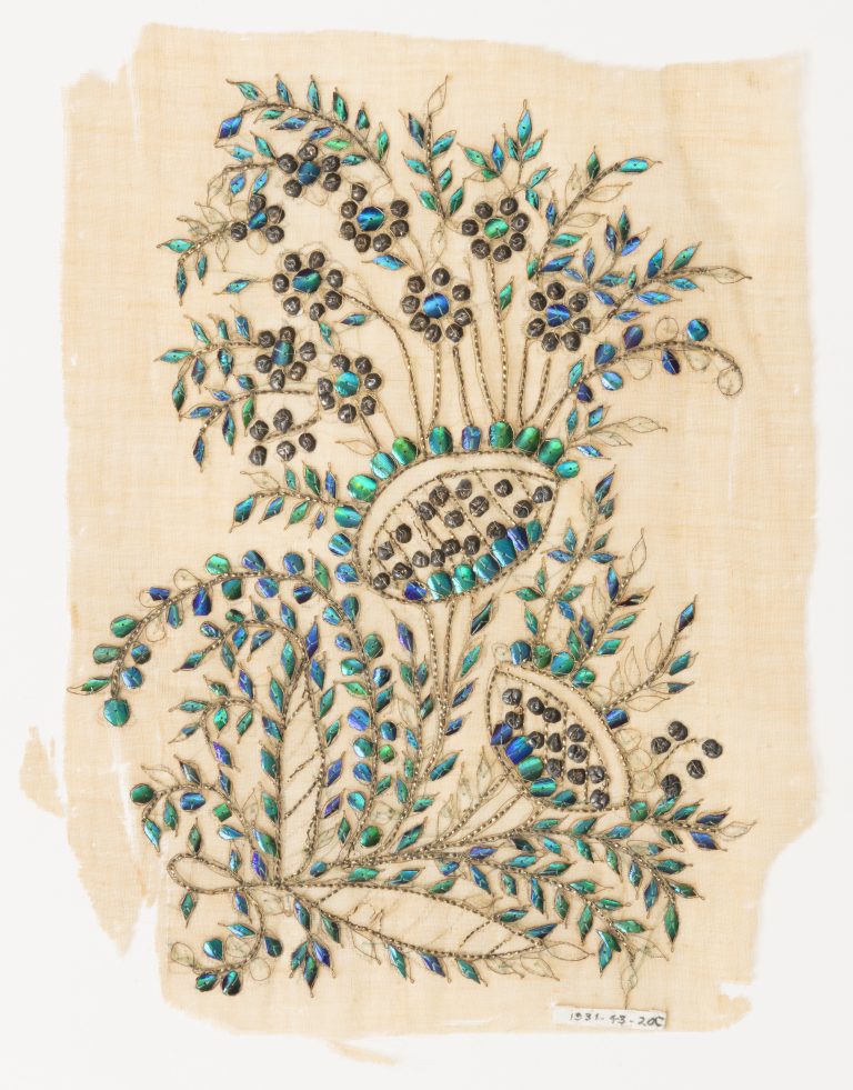 Artistic application of the iridescent elytra (wing cases) of beetles onto fabric