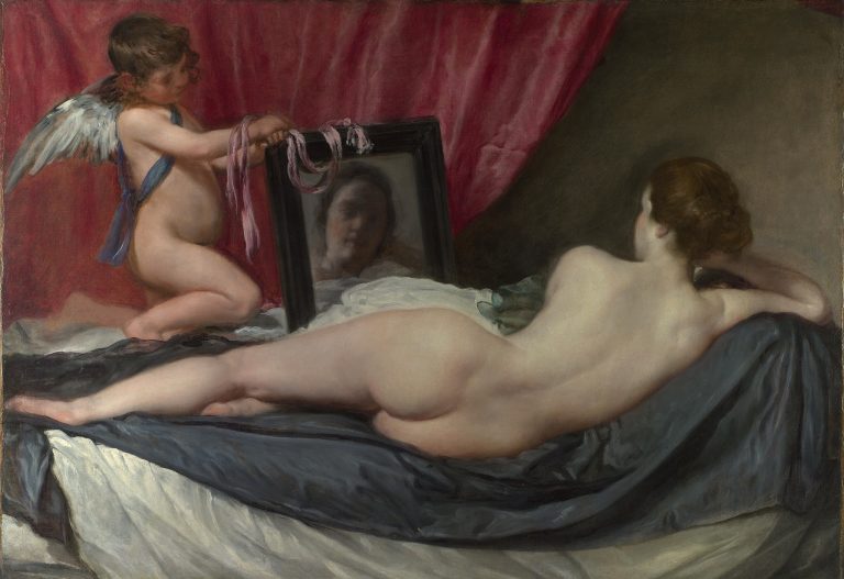 The goddess Venus reclining with her back to the viewer, gazing into a mirror held by her son, Cupid.
