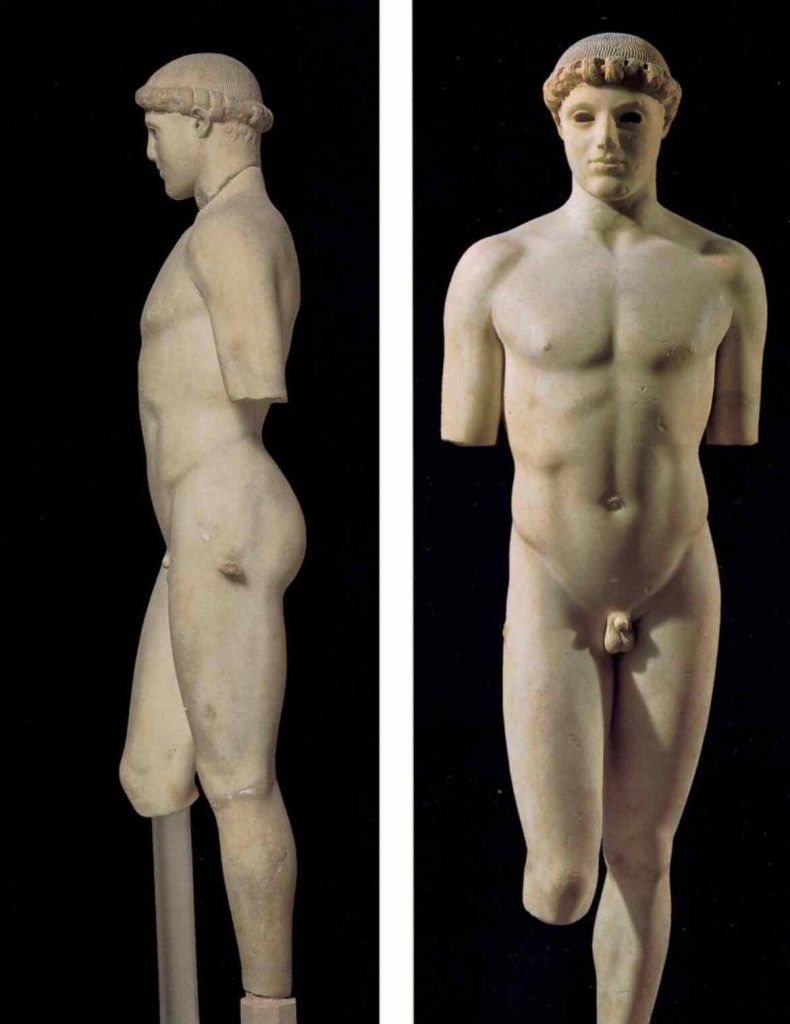 The "Kritios Boy" is depicted standing in the nude. He supports his weight on his left leg, while the right one remains loose, bent at the knee, in the characteristic posture of the "Severe Style"
