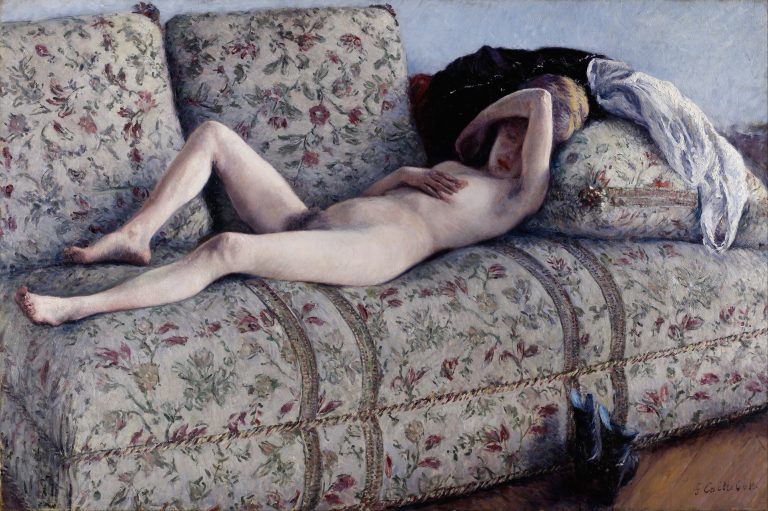 A woman reclining on a floral sofa, often with her clothes casually discarded nearby