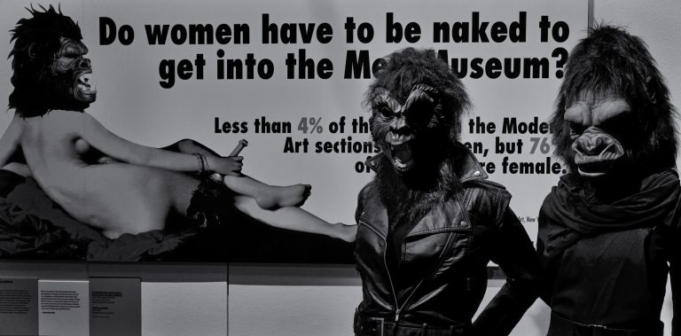Poster-style artwork critiquing museum collections, featuring bold text and a masked female figure alongside statistical commentary on gender representation in art institutions