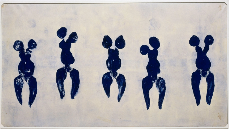 Performance-based artwork showing nude female bodies pressed and dragged across canvas, leaving blue pigment imprints in abstract, gestural composition